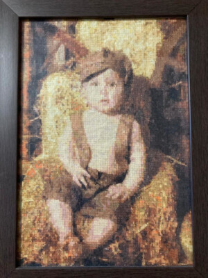 Complete Boy in a brown cap cross-stitching design