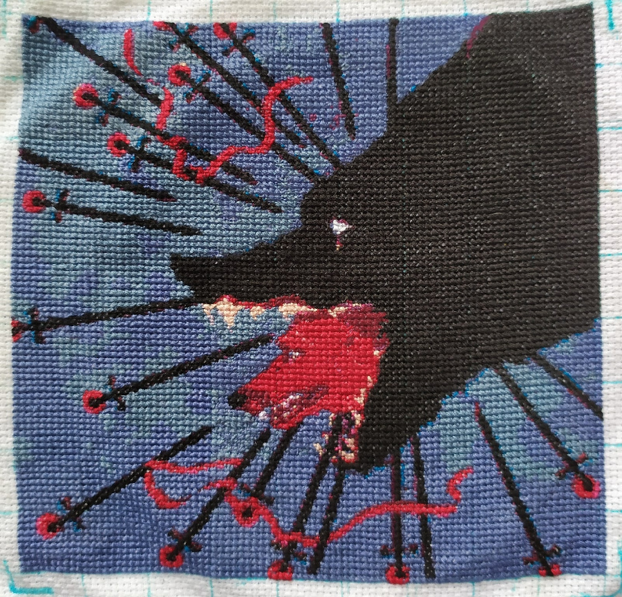 Complete A red dog peeks out of a black dog's mouth cross-stitching design